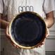 Чорна кругла тарілка із золотим обідком 25,5 см